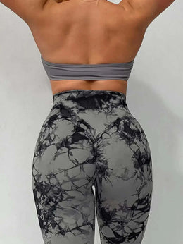 Woman wearing black stretch fitness yoga pants performing yoga pose